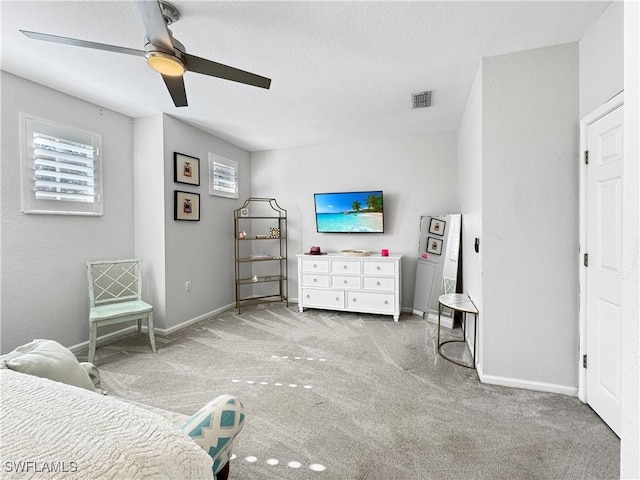 bedroom with light colored carpet and ceiling fan