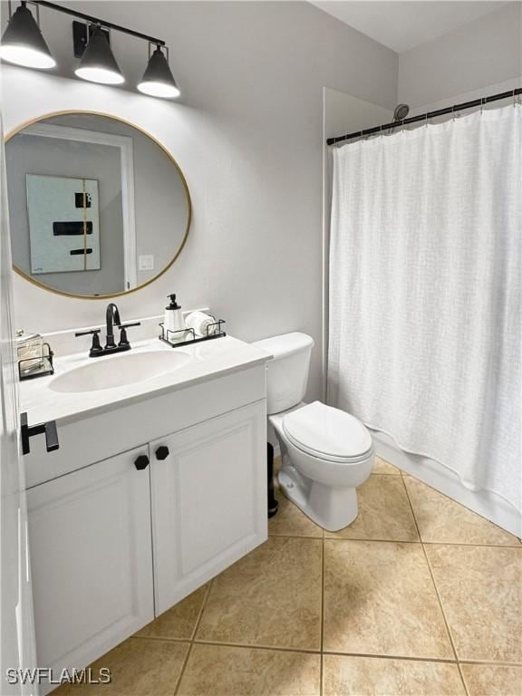 full bathroom with tile patterned flooring, vanity, toilet, and shower / bathtub combination with curtain