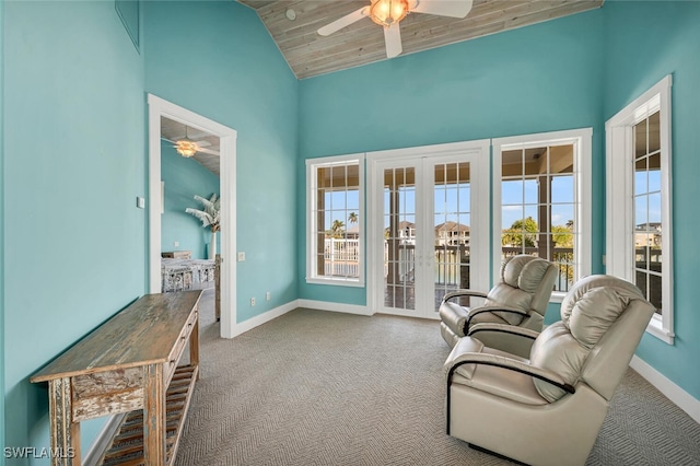 sitting room featuring wood ceiling, ceiling fan, carpet flooring, and vaulted ceiling