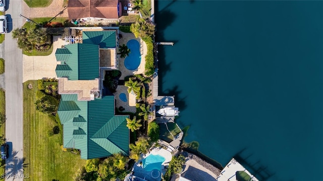 birds eye view of property featuring a water view