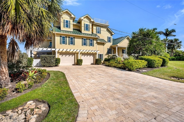 view of front of home with a garage and a front yard