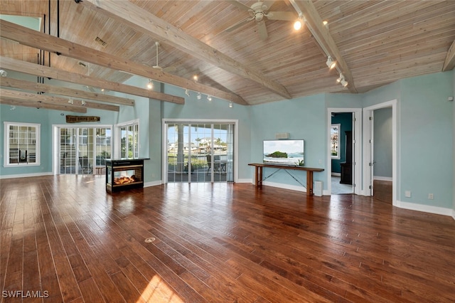 unfurnished living room featuring beamed ceiling, ceiling fan, wood ceiling, and hardwood / wood-style floors