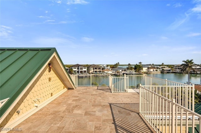 view of patio with a water view