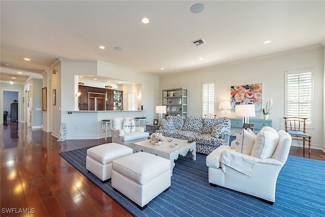 living room featuring crown molding and dark hardwood / wood-style flooring