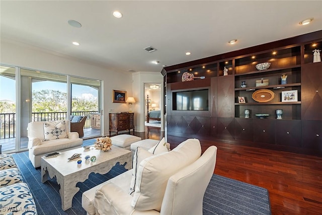 living room featuring crown molding and dark hardwood / wood-style floors