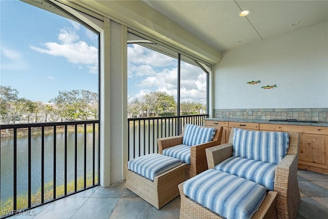 sunroom with a water view