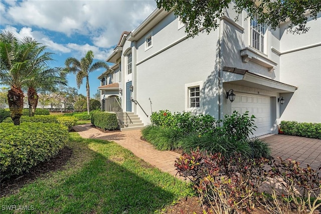 view of side of property featuring a garage