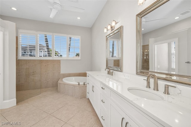 bathroom with ceiling fan, vanity, plus walk in shower, and tile patterned flooring