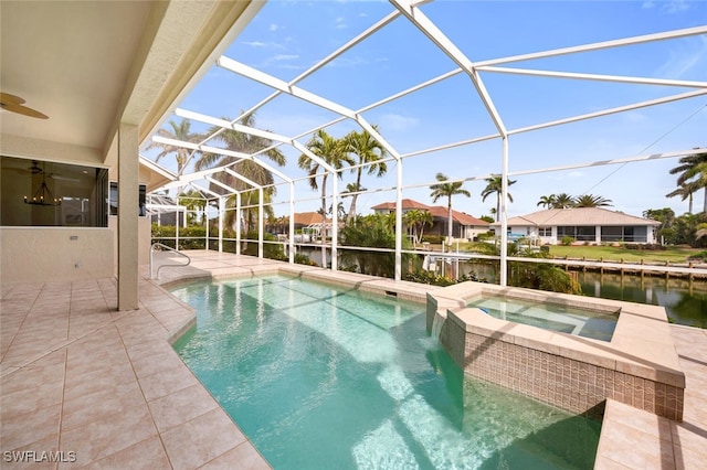 view of swimming pool with a water view, an in ground hot tub, a lanai, and a patio area