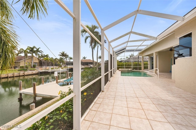 exterior space featuring a water view and vaulted ceiling