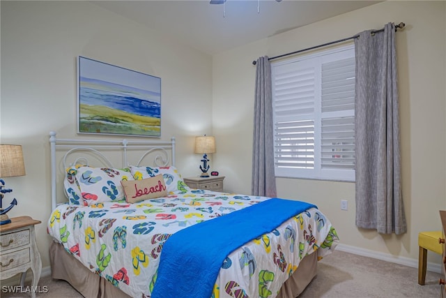 bedroom featuring light carpet and ceiling fan