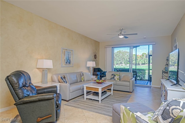 tiled living room featuring ceiling fan