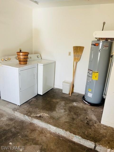 laundry area featuring washing machine and dryer and electric water heater