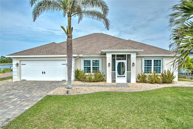 ranch-style house with a garage and a front yard