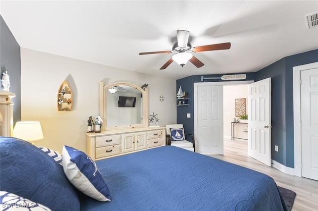 bedroom with light hardwood / wood-style flooring and ceiling fan