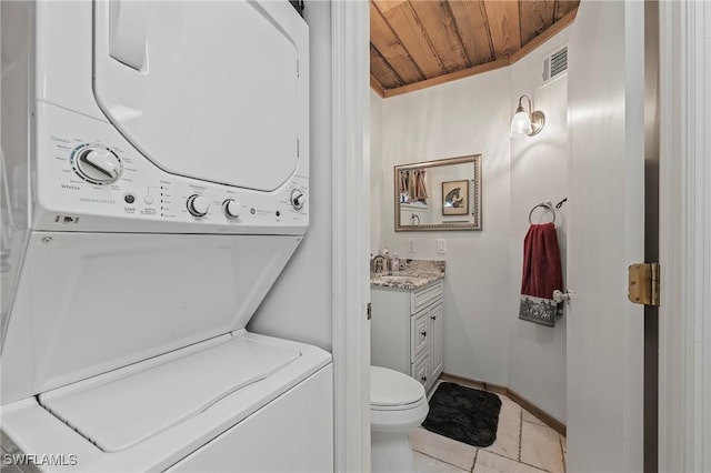 washroom featuring stacked washer and dryer, sink, and wood ceiling