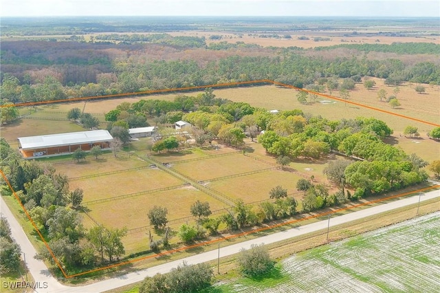 birds eye view of property with a rural view