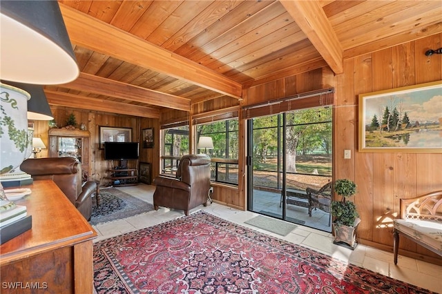 tiled living room featuring beamed ceiling, wooden walls, and wooden ceiling