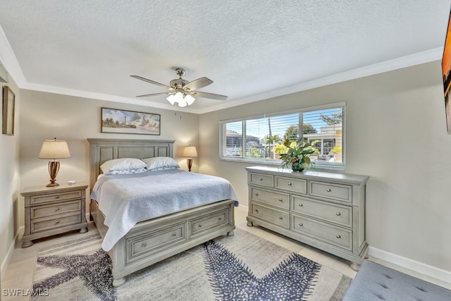 bedroom with ceiling fan, ornamental molding, and a textured ceiling