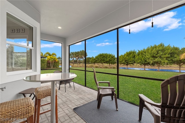 sunroom with a water view