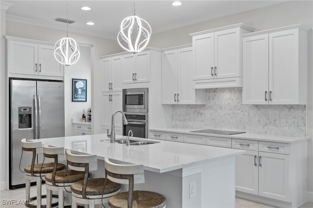 kitchen with visible vents, white cabinets, stainless steel appliances, premium range hood, and backsplash