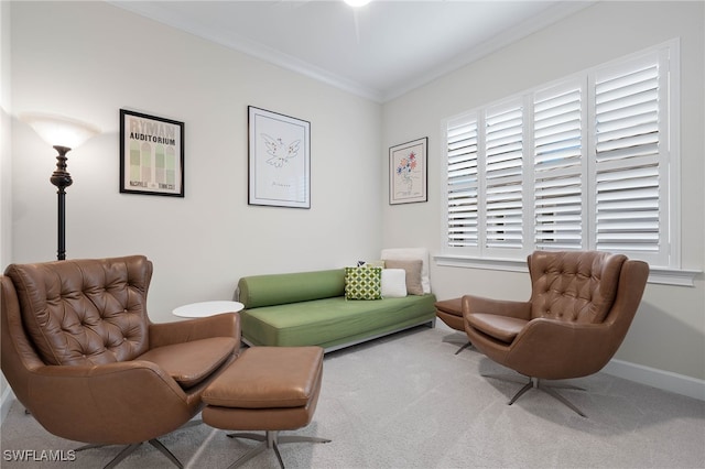 living area featuring ornamental molding, carpet floors, and baseboards