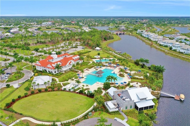 drone / aerial view with a water view and a residential view