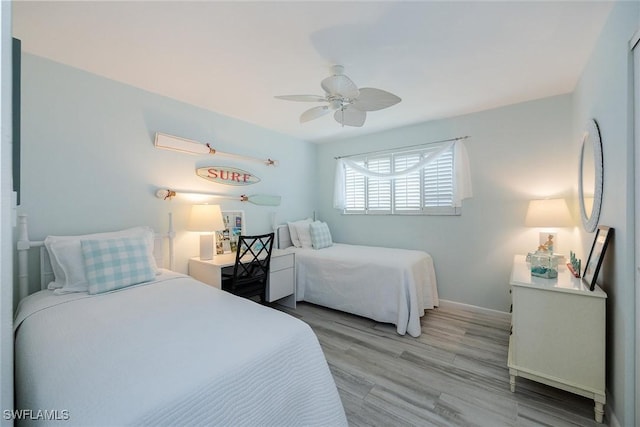 bedroom featuring ceiling fan and light wood-type flooring