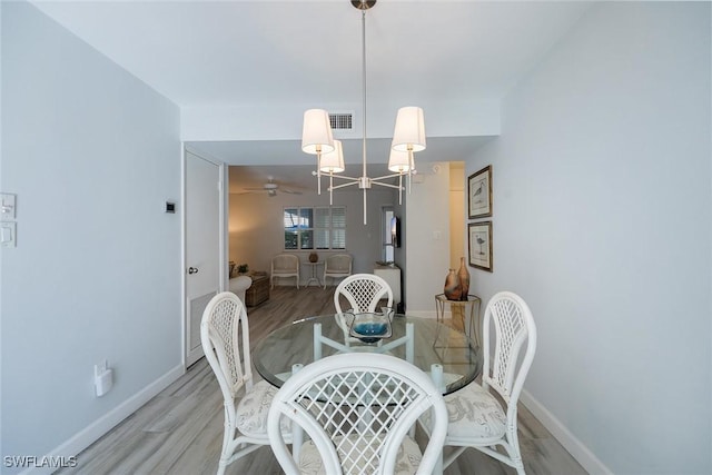 dining area featuring light wood-type flooring