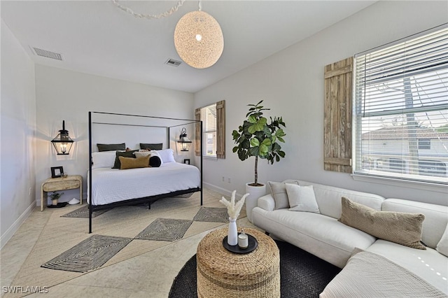 bedroom featuring light tile patterned flooring