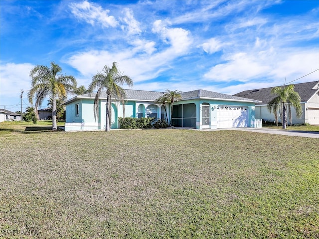 ranch-style home with a garage and a front yard