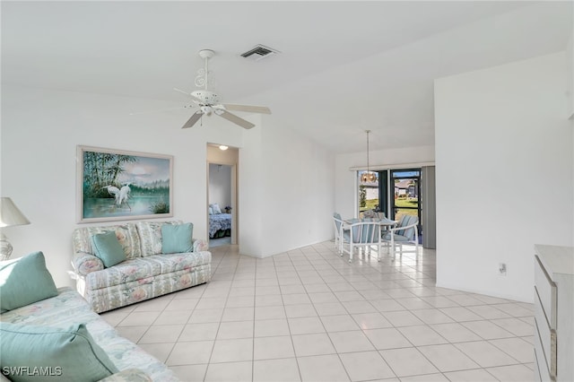 tiled living room with ceiling fan and lofted ceiling