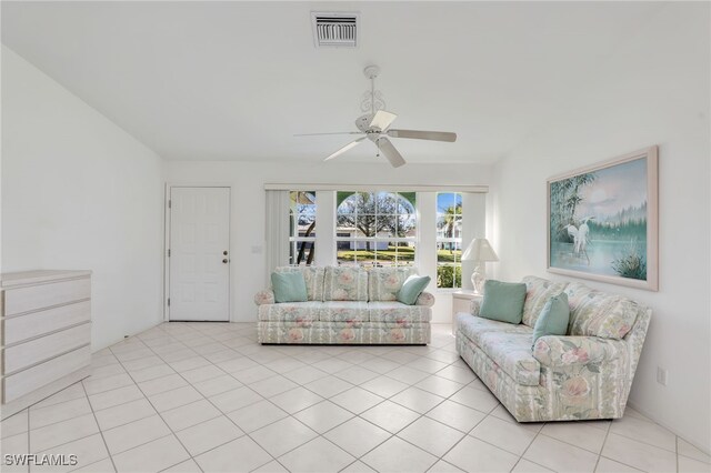 living room with light tile patterned floors and ceiling fan