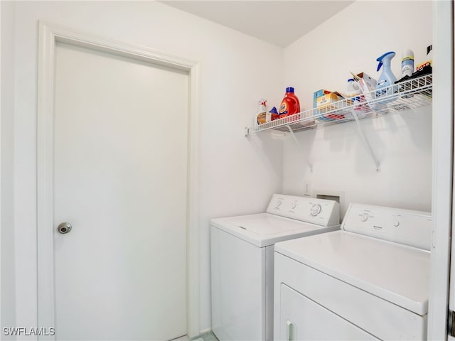 laundry room with independent washer and dryer