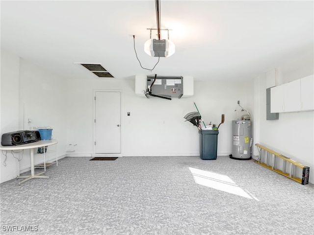 garage with a garage door opener and electric water heater