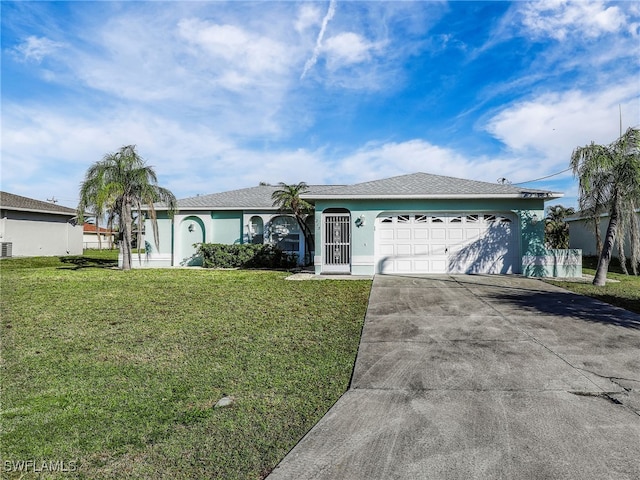 ranch-style house with a garage and a front lawn