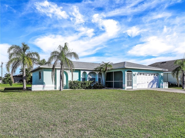 ranch-style home featuring a garage and a front lawn