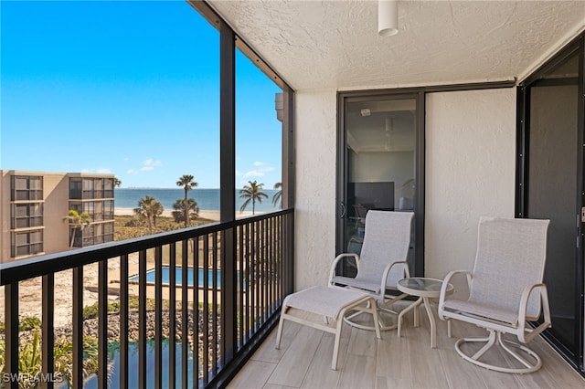 balcony featuring a water view