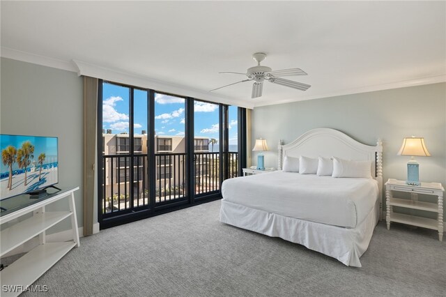 carpeted bedroom with access to outside, ornamental molding, floor to ceiling windows, and ceiling fan