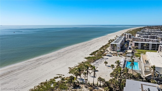 drone / aerial view featuring a view of the beach and a water view