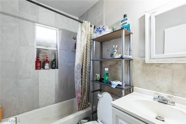 full bathroom with vanity, toilet, and shower / bath combo with shower curtain