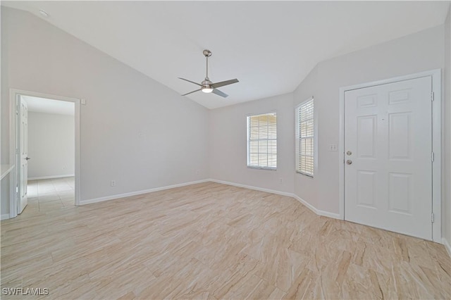 spare room with ceiling fan and vaulted ceiling