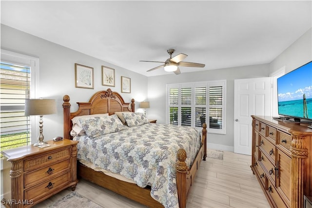 bedroom with ceiling fan and light hardwood / wood-style floors