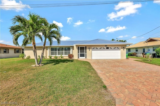 single story home with a garage, a front yard, and central air condition unit