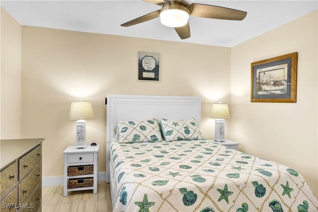 bedroom featuring light hardwood / wood-style floors and ceiling fan