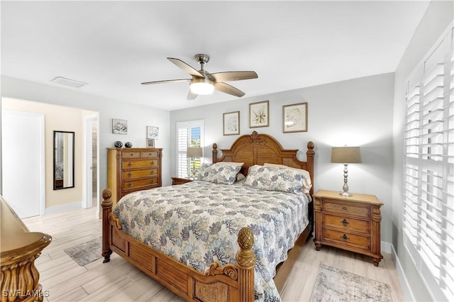 bedroom with light hardwood / wood-style flooring and ceiling fan