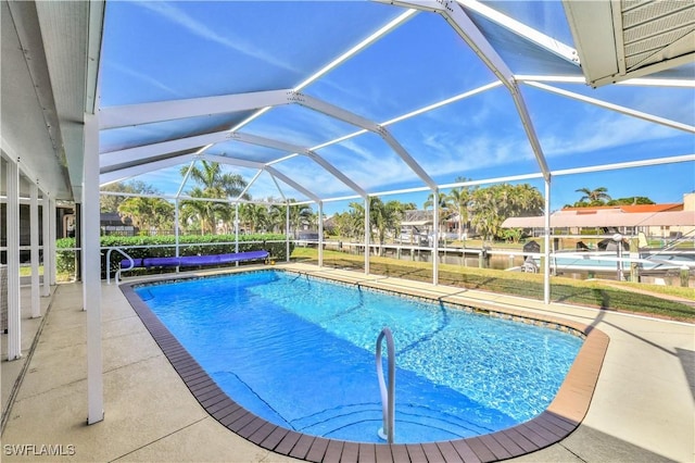 view of pool featuring a lanai and a patio