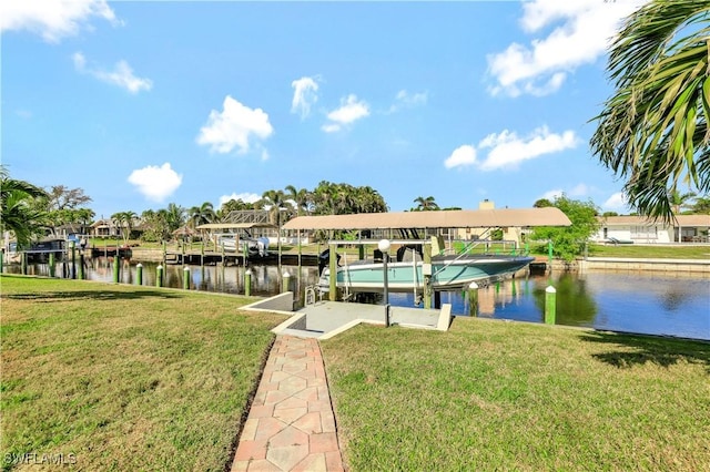 view of dock featuring a lawn and a water view