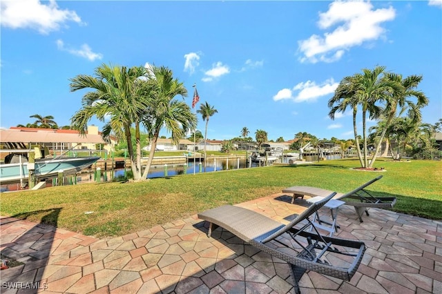 view of patio / terrace with a water view and a boat dock