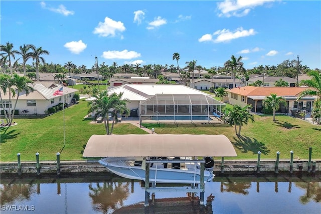 exterior space with a water view, a lanai, and a yard